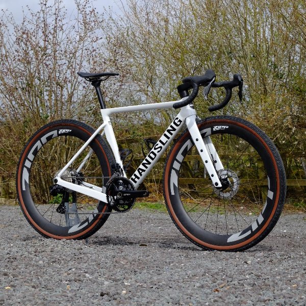 Handsling A1R0evoG Shimano GRX Di2 white gravel bike with Zipp wheels.