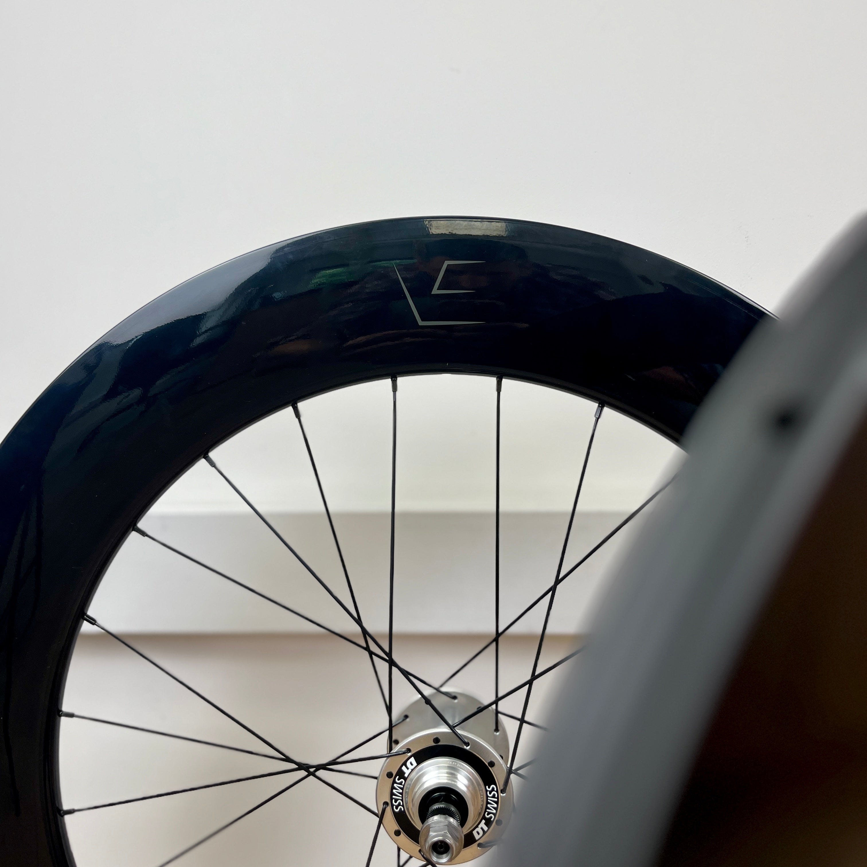 Close-up of a bicycle wheel with a blurred background